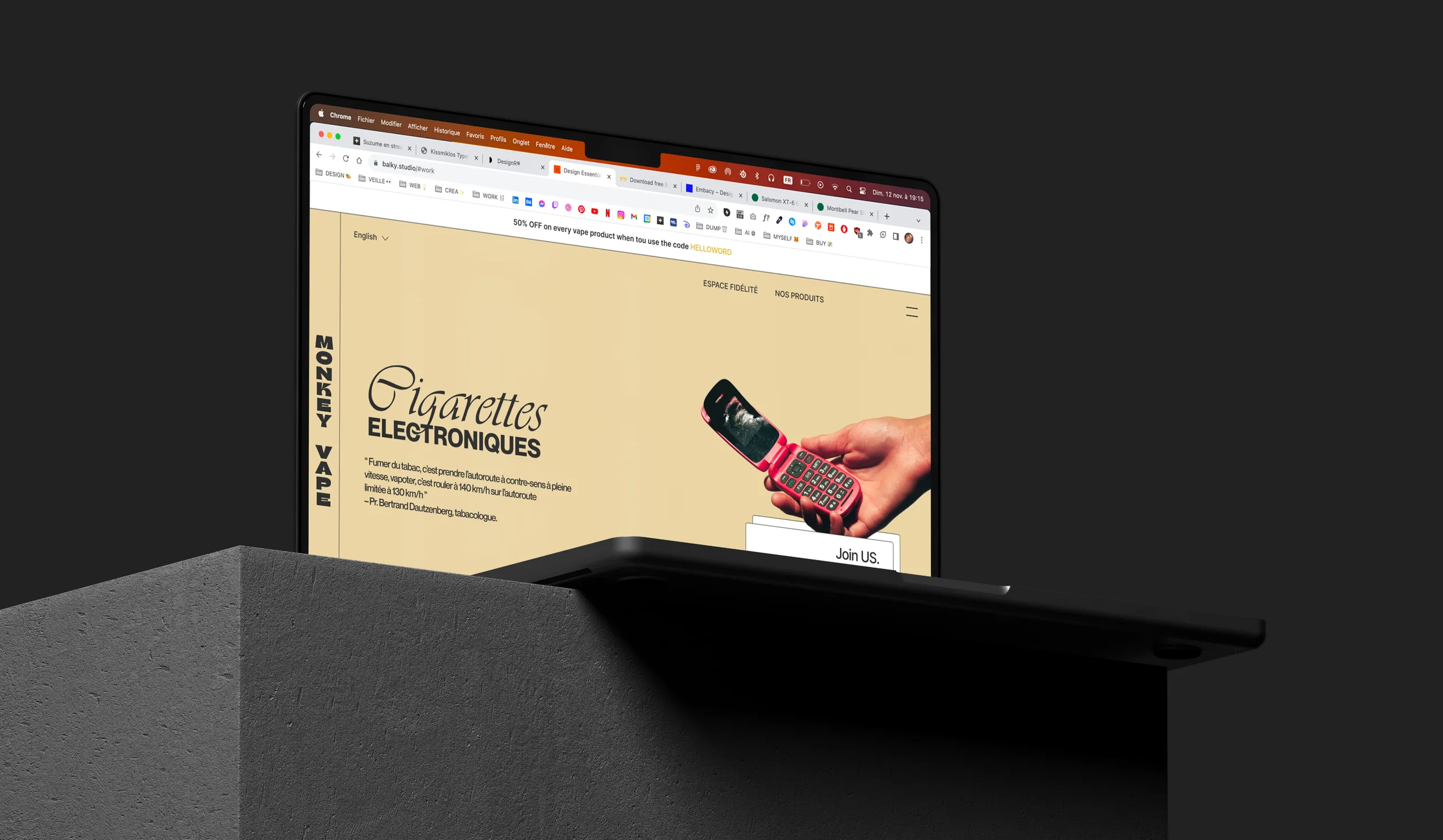 The Monkey Vape website on a MacBook set on a concrete plinth