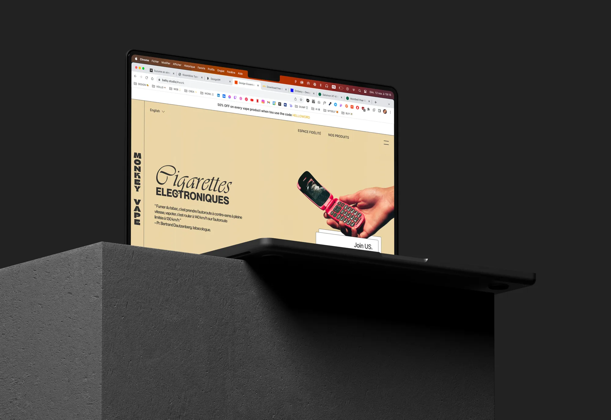 The Monkey Vape website on a MacBook set on a concrete plinth